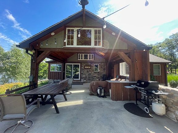 Overhang patio with waterfall, fire-pit great for bbq