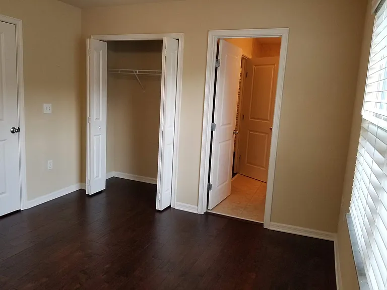 Bedroom 2 closet and door to bathroom
