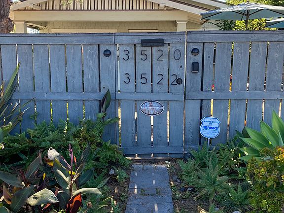 Street front access to the gated compound and owner's residence.