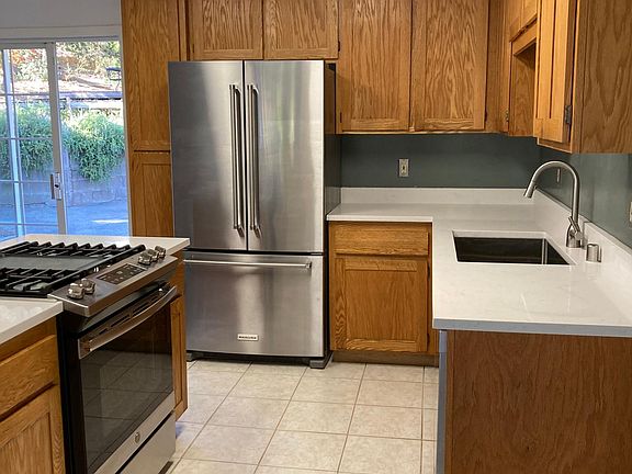 Updated kitchen with gas range and quartz countertops.