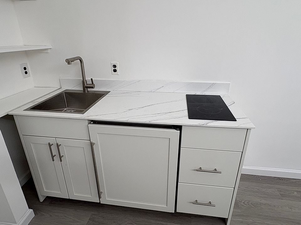 Kitchenette, sink, refrigerator, stove top