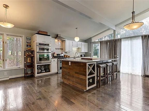 Kitchen with dishwasher, microwave, two ovens and a gas stovetop_fridge is to the left out of the picture
