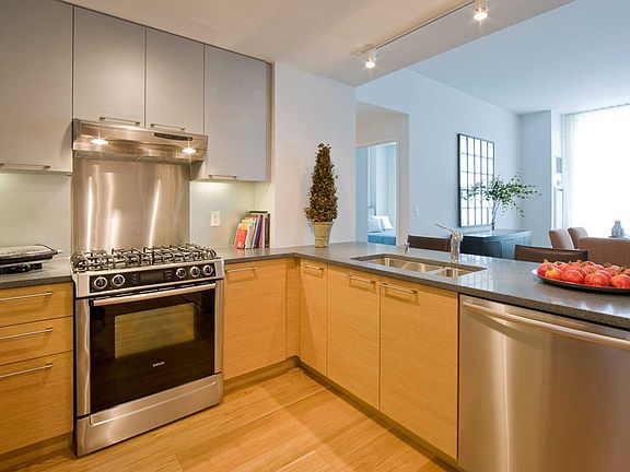Kitchen with Stainless Steel Appliances, Granite Countertops and Hard Surface Flooring