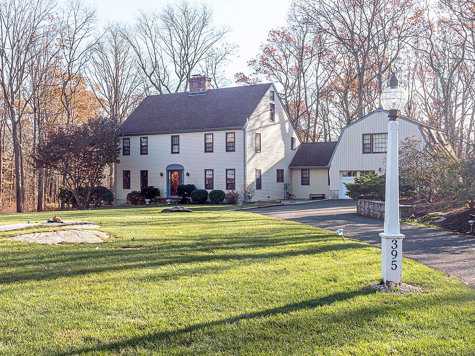 Lovely Colonial beautifully sited on two acres in a desirable cul-de-sac neighborhood
