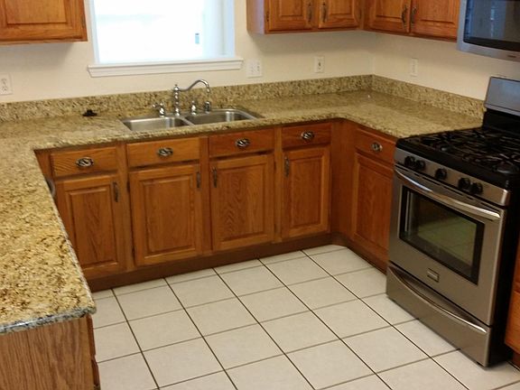 Chef's kitchen lots of storage and stainless steel appliances