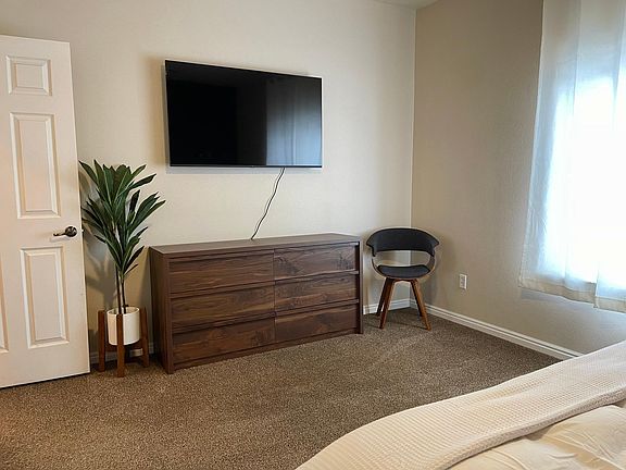 Master bedroom w/ 55" smart TV