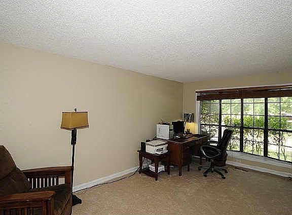 Wall of built-ins and fireplace with gorgeous mantle