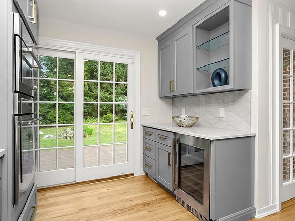Wine fridge and French doors to the backyard