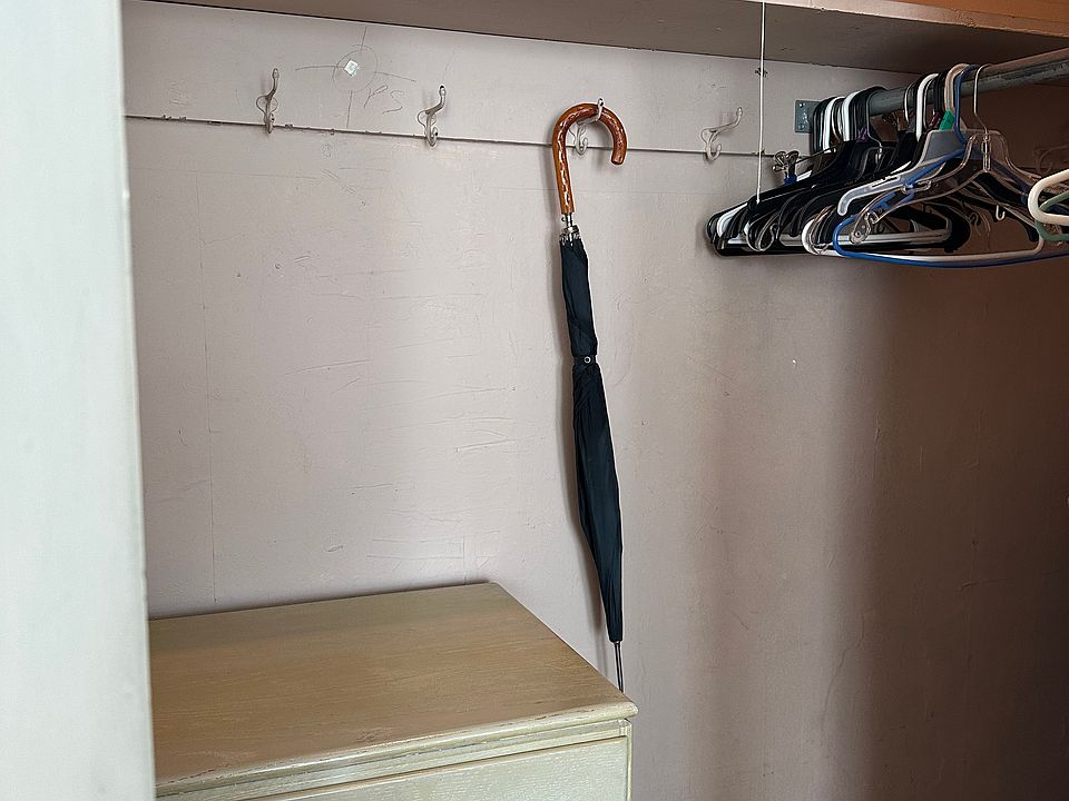 Walk-in closet and dresser in main bedroom. There's also a dresser in the bedroom.