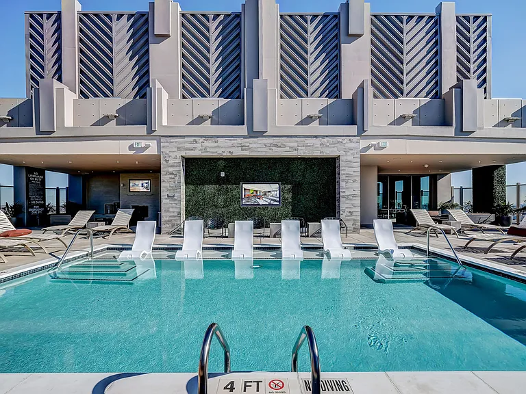 Stunning roof top pool on the sky deck with tanning deck and stunning city views