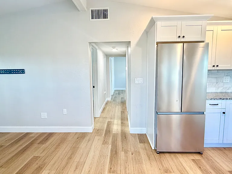 Hall to sleeping area and bath