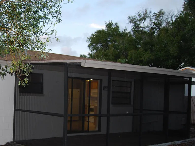 Screen Enclosure. Huge Back yard with privacy fence throughout the entire perimeter.
