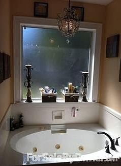 chandelier over Lg bath, sep shower, his and her sinks, new fixtures, Lg closet