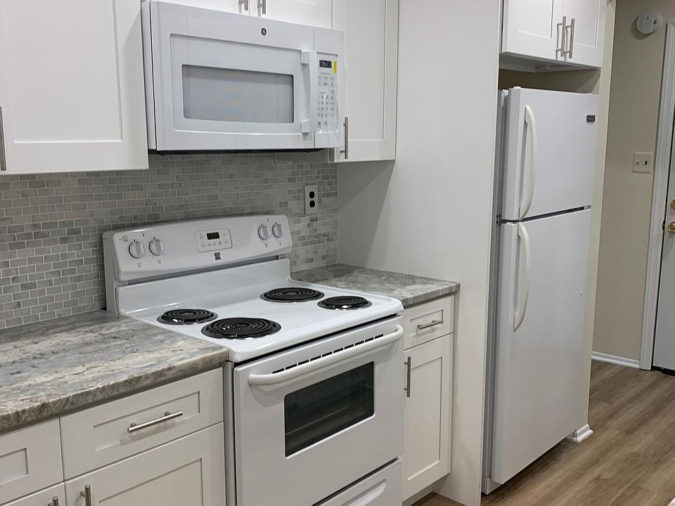 New kitchen with beautiful granite countertops and plenty of storage.