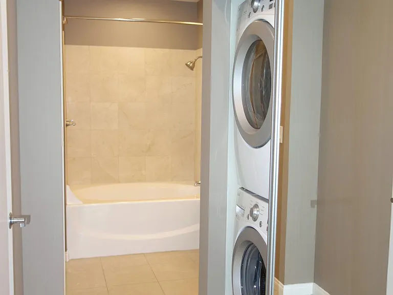 Washer and Dryer in Unit / Walk-In Closet to the left