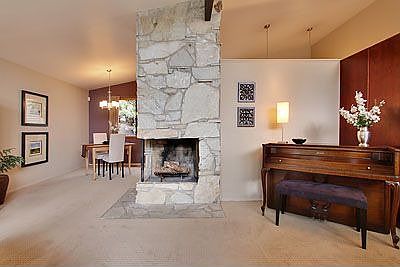Beautiful stone fireplace can be enjoyed from the living room and dining room.