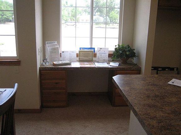 Window desk between kitchen and dining room