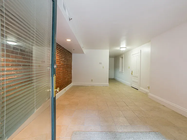 Living Area With Exposed Brick