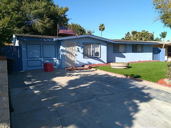Half garage for storage and driveway parking for two cars.