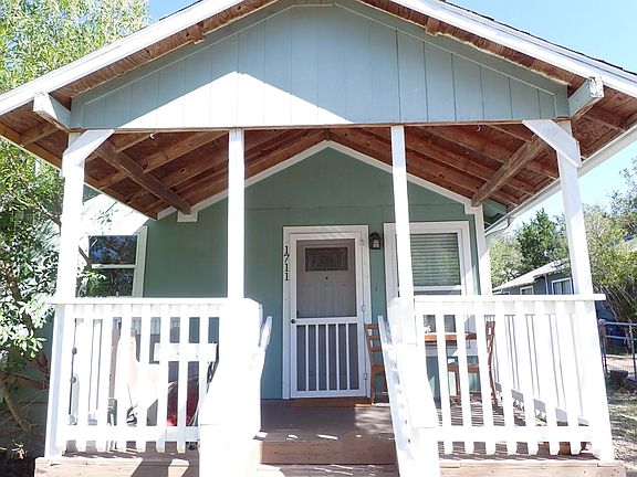 Great front porch for drinking your coffee in the morning!