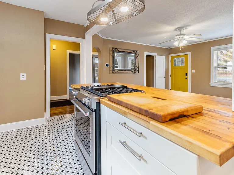 stainless Kitchen Aid Appliances and Penny Tile floor at 907 W Wendover ave