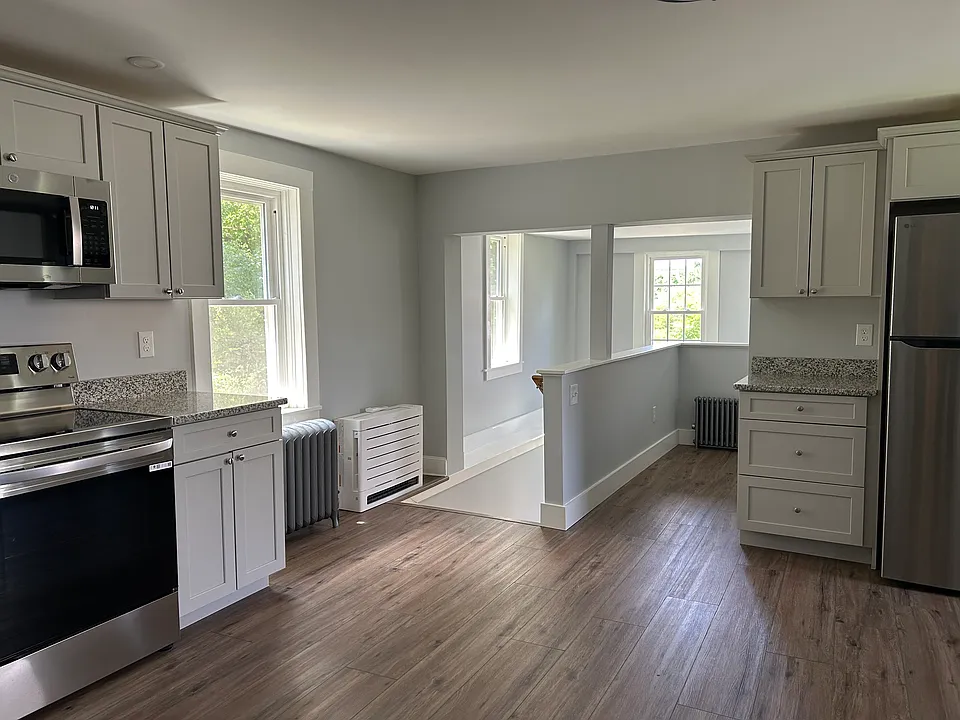 Kitchen - stairs at left exit to back door
16-1/2' x 17'