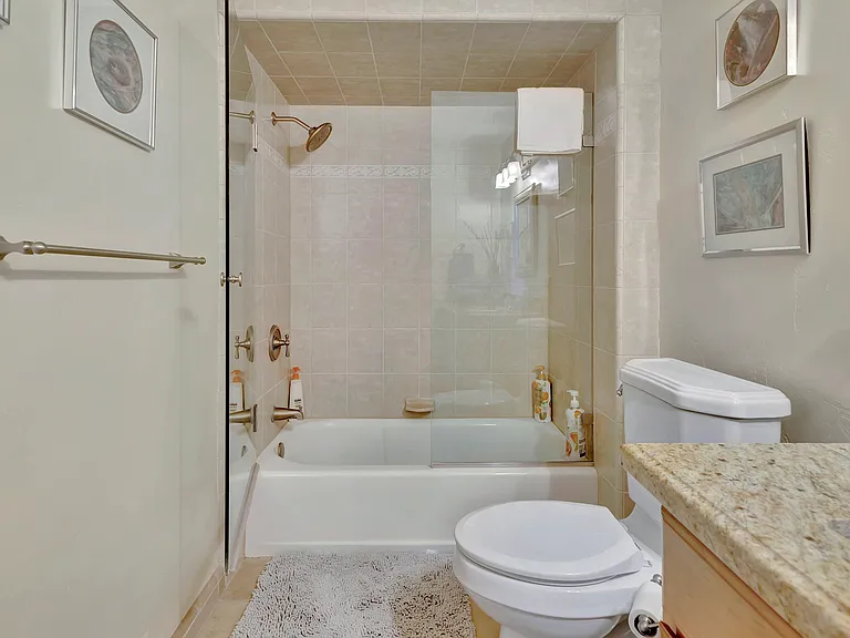 Bathroom 2 with beautifully tiled shower/tub (downstairs)