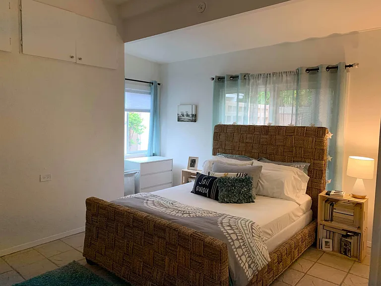 Large and bright bedroom with lots of storage space.