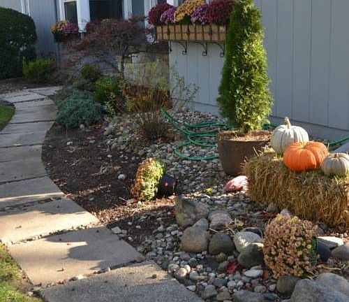 The walkway leading from the driveway to the front entrance is lined with landscaping and gives your guest a welcome feel as they approach the front entrance.