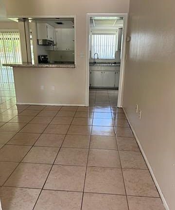 Front door foyer going into kitchen