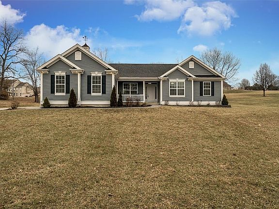 Large front yard with 3 car side entry garage.