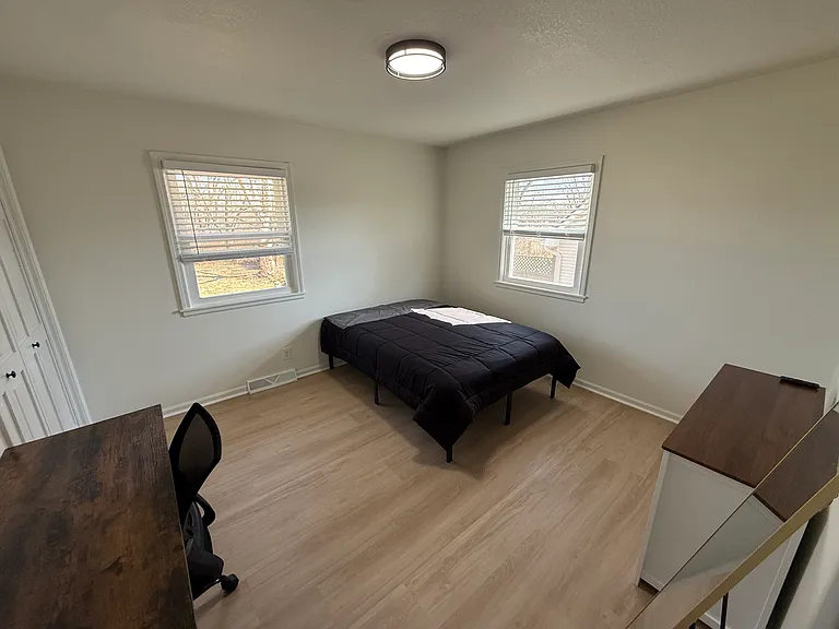 Full size bed w/ linens, desk, dresser, stand up mirror, night stand and smart TV in each room