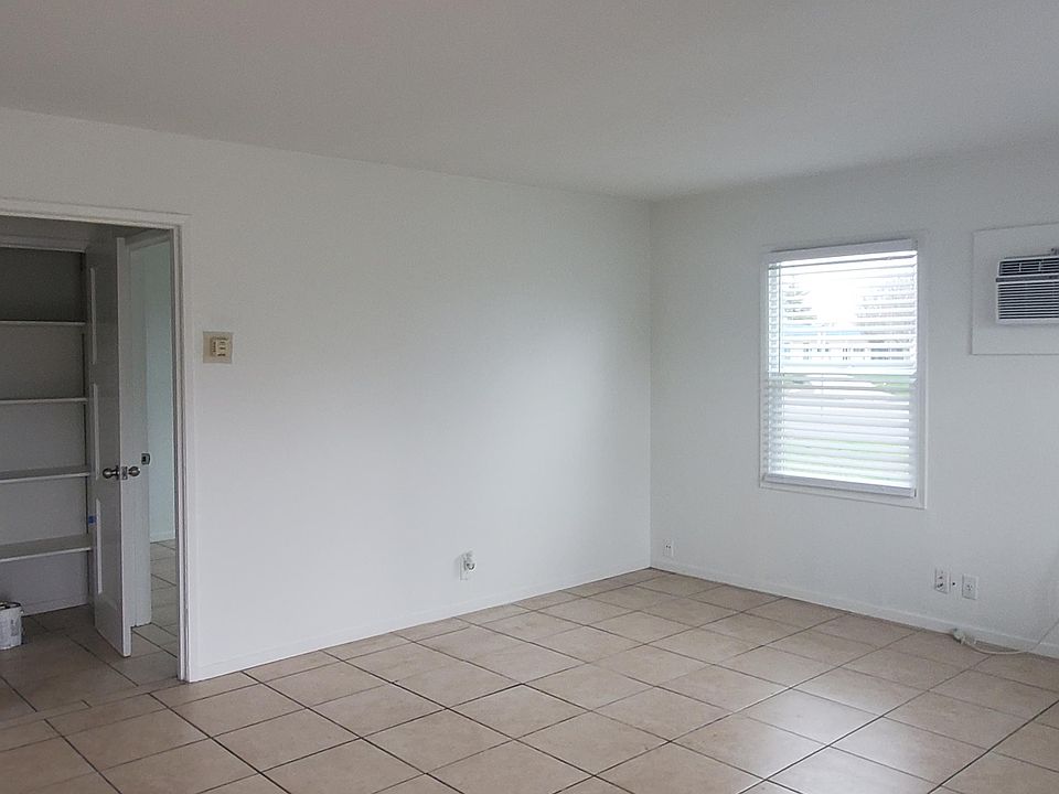 Living Room at Front Entry with AC and Heater Wall Units