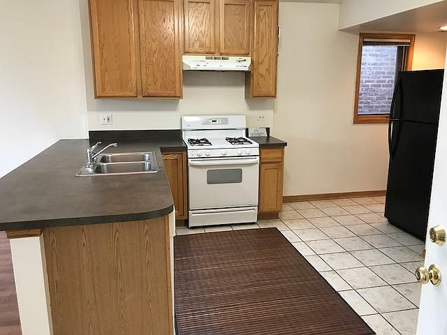 Kitchen (note that new range is not seen, which is black. Installed in 2024).