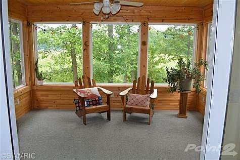 3 season porch to enjoy your morning coffee.  Look at all that view!
