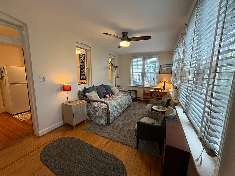 Bedroom 2 with seating and small table or workspace