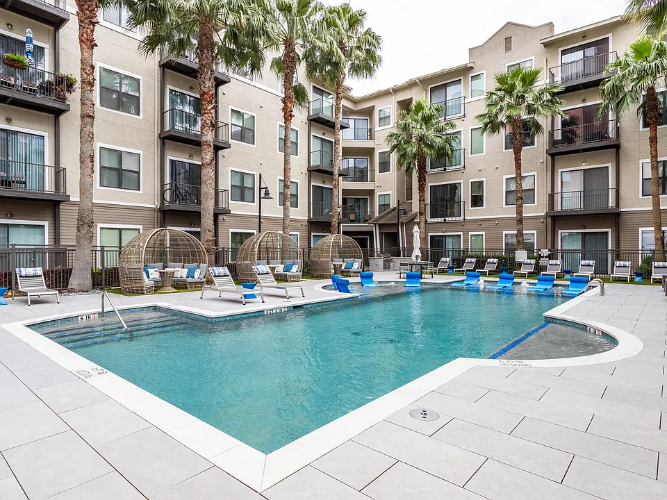 Relax poolside in the resort-style courtyard at Hermann Park Lofts.