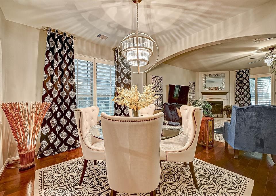 Magazine worthy dining room! Check out the chandelier and those hardwood floors!