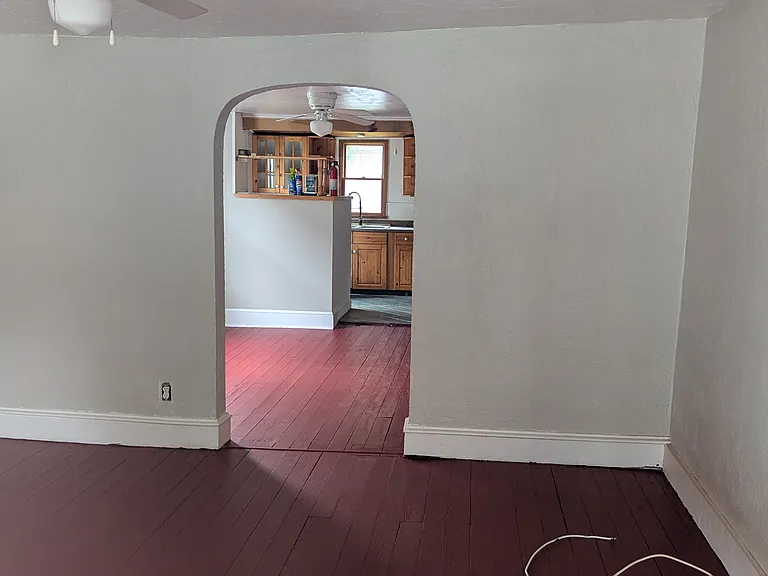 Front door, through living room, dining room, and into kitchen.