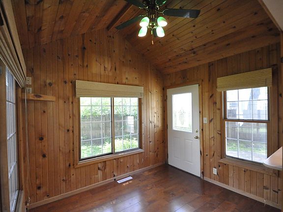 sunroom/nook next to kitchen. nice wood cabin vibe