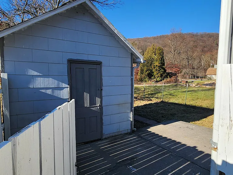 Side Yard Entrance & Exterior Storage Room