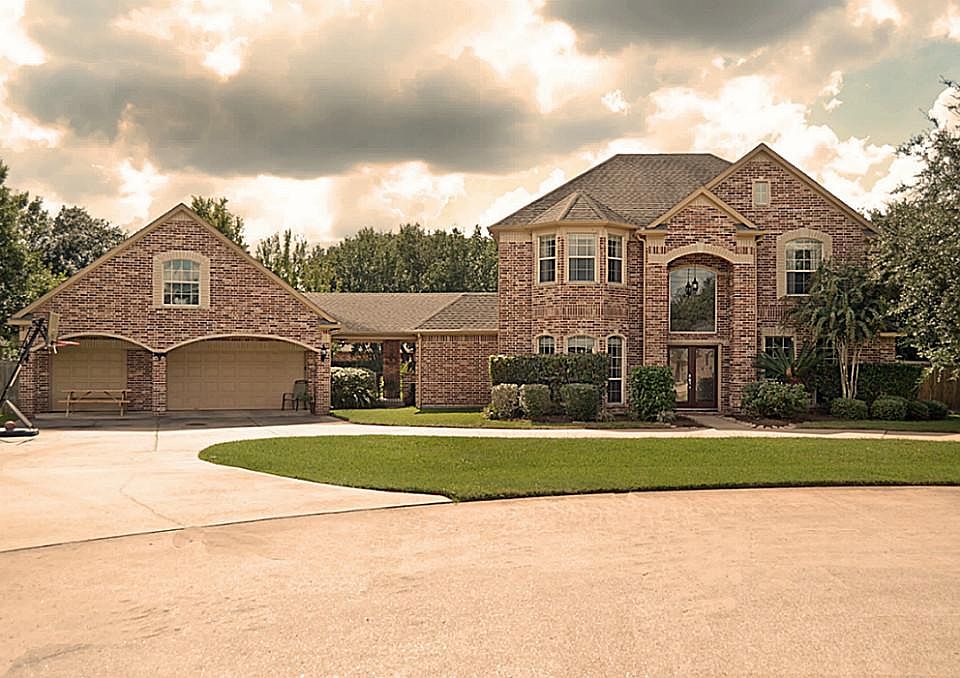 The drive not only leads guests to your home, it also leads to the Garage that measures an impressive 28 feet deep, has an overhead door to the backyard and is functionally fronted with a full sized, 3-car Porte Cochere