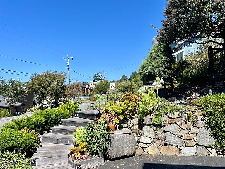 Stairs from the driveway leading up to the front door