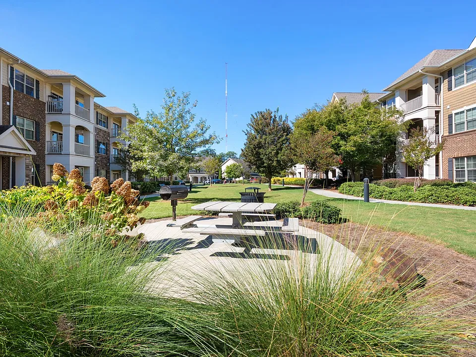 Lush landscaping and modern design create the perfect first impression.