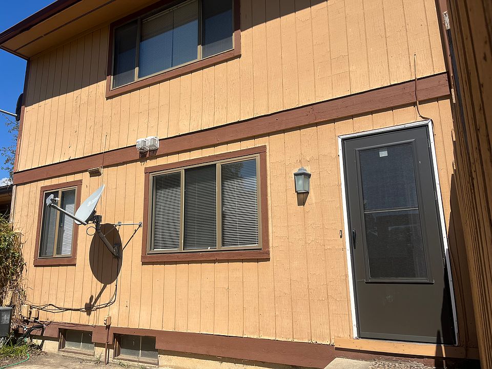 back of unit facing carport and outdoor storage room
