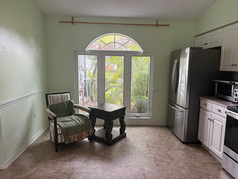 Kitchen, with large window, plenty of natural light.