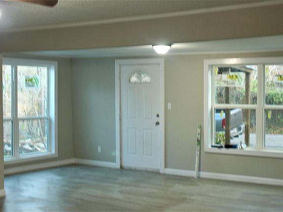 Front entrance area. Lots of light from the windows on either side.
