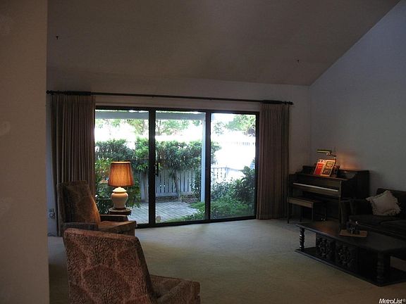 Sliding doors provide access to the charming patio off the living room.