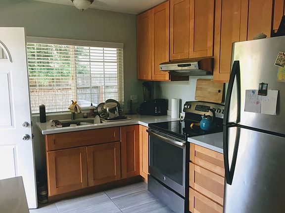 almost new appliances, wood cabinetry, ceramic tile floor, q