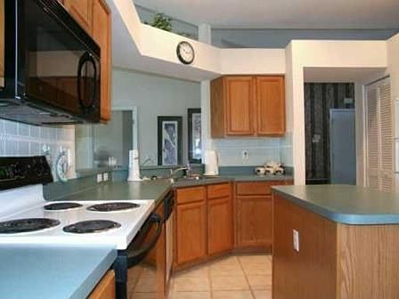 Kitchen with pass-through and island